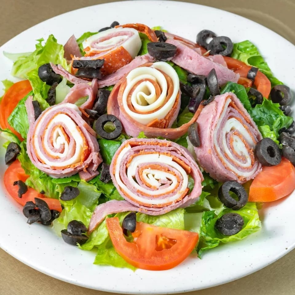 Brooklyn Pizzeria's antipasto salad with rolled meats, cheese, olives, lettuce, and tomatoes.